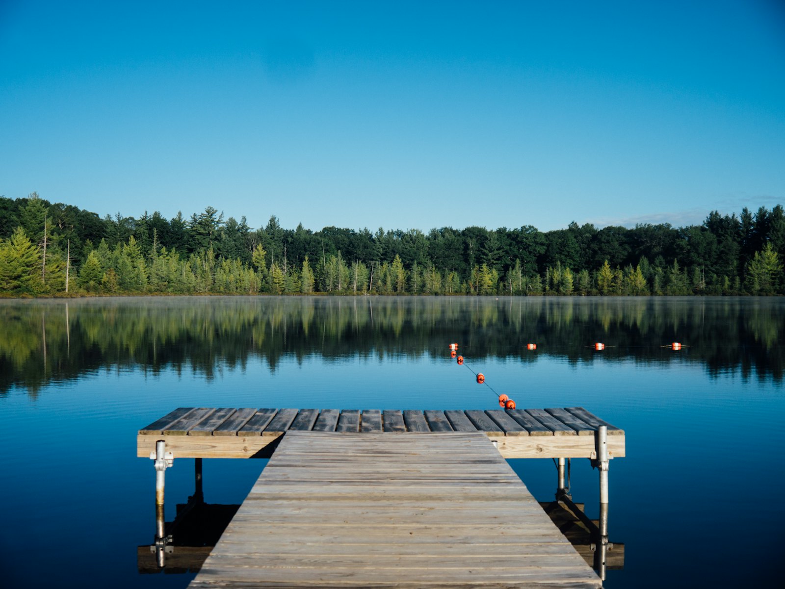 Calm lake with a wooden dock